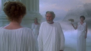 Movie still from “Clash of the Titans” (1981), directed by Desmond Davis – A man and two women dressed in ancient roman clothing; Medium shot, Over the shoulder angle