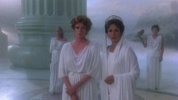 Movie still from “Clash of the Titans” (1981), directed by Desmond Davis – A group of women dressed in ancient roman clothing; Medium shot, Over the shoulder angle