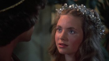 Movie still from “Clash of the Titans” (1981), directed by Desmond Davis – A young woman wearing a tiara looking at a man; Close Up shot, Over the shoulder angle