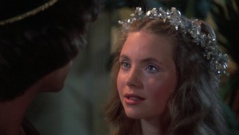 Movie still from “Clash of the Titans” (1981), directed by Desmond Davis – A young girl wearing a tiara looking at a young man; Close Up shot, Over the shoulder angle