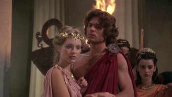 Movie still from “Clash of the Titans” (1981), directed by Desmond Davis – A man and a woman dressed in ancient roman garb; Medium shot, Over the shoulder angle