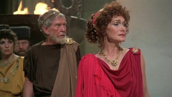 Movie still from “Clash of the Titans” (1981), directed by Desmond Davis – A man and a woman dressed in ancient roman clothing; Close Up shot, Over the shoulder angle
