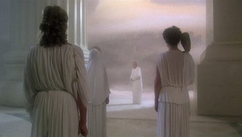Movie still from “Clash of the Titans” (1981), directed by Desmond Davis – A group of people dressed in ancient roman clothing; Wide shot, Low angle