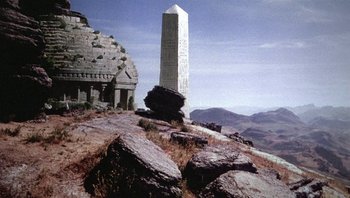 Movie still from “Clash of the Titans” (1981), directed by Desmond Davis – A large stone monument on top of a hill; Extreme Wide shot, Low angle