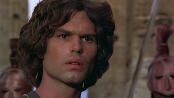 Movie still from “Clash of the Titans” (1981), directed by Desmond Davis – A person with long hair; Close Up shot, Low angle