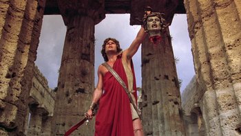 Movie still from “Clash of the Titans” (1981), directed by Desmond Davis – A man dressed in ancient roman clothing holding a sword; Medium shot, Low angle