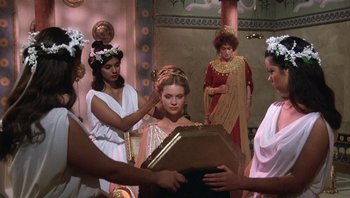 Movie still from “Clash of the Titans” (1981), directed by Desmond Davis – A group of women dressed in ancient roman garb; Medium shot, Over the shoulder angle