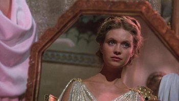 Movie still from “Clash of the Titans” (1981), directed by Desmond Davis – A beautiful young lady looking into a mirror; Close Up shot, Over the shoulder angle