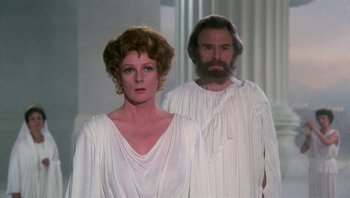 Movie still from “Clash of the Titans” (1981), directed by Desmond Davis – A man and a woman dressed in roman clothing; Medium shot, Low angle