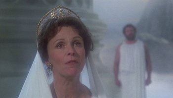 Movie still from “Clash of the Titans” (1981), directed by Desmond Davis – A woman wearing a crown and veil in front of a man; Close Up shot, Over the shoulder angle