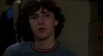 Movie still from “Class” (1983), directed by Lewis John Carlino – A young man is looking into the camera; Close Up shot, Low angle