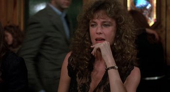 Movie still from “Class” (1983), directed by Lewis John Carlino – A person sitting in a room; Close Up shot, Over the shoulder angle