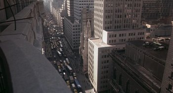 Movie still from “Class” (1983), directed by Lewis John Carlino – An aerial view of a busy city street with traffic; Extreme Wide shot, High angle