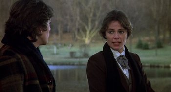 Movie still from “Class” (1983), directed by Lewis John Carlino – Two people standing next to a body of water; Medium shot, Over the shoulder angle