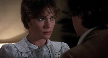 Movie still from “Class” (1983), directed by Lewis John Carlino – A person wearing a shirt; Close Up shot, Over the shoulder angle