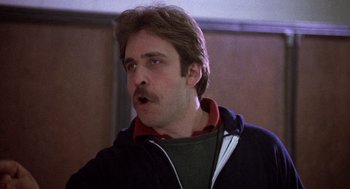 Movie still from “Class” (1983), directed by Lewis John Carlino – A person wearing a jacket; Close Up shot, Low angle