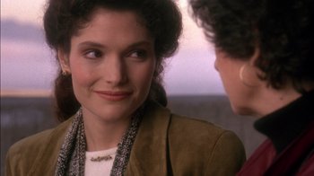 Movie still from “Class Action” (1991), directed by Michael Apted – A woman in a brown jacket talking to another woman; Close Up shot, Over the shoulder angle