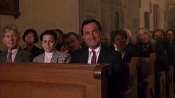 A group of people sitting in a church pews