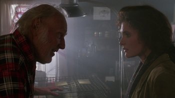 Movie still from “Class Action” (1991), directed by Michael Apted – A man and a woman face to face in a room; Close Up shot, Over the shoulder angle