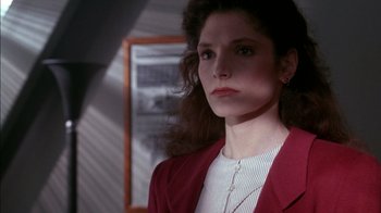 Movie still from “Class Action” (1991), directed by Michael Apted – A person wearing a jacket; Close Up shot, Over the shoulder angle