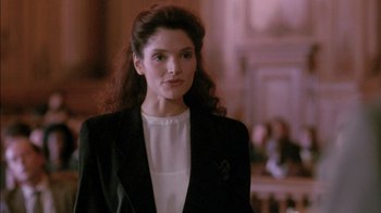 Movie still from “Class Action” (1991), directed by Michael Apted – A woman in a black jacket and a white blouse; Close Up shot, Over the shoulder angle