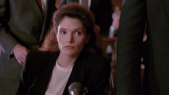 Movie still from “Class Action” (1991), directed by Michael Apted – A person wearing a suit and tie; Close Up shot, Over the shoulder angle