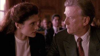 Movie still from “Class Action” (1991), directed by Michael Apted – A man and a woman are talking to each other; Close Up shot, Over the shoulder angle