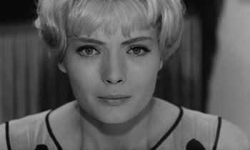 Movie still from “Cléo from 5 to 7” (1962), directed by Agnès Varda – Black and white photograph of a woman with short blonde hair; Close Up shot, Over the shoulder angle