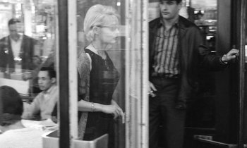 Movie still from “Cléo from 5 to 7” (1962), directed by Agnès Varda – A man and a woman looking out of a train window; Medium shot, Over the shoulder angle