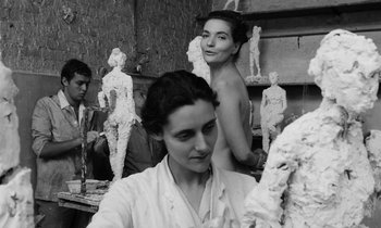 Movie still from “Cléo from 5 to 7” (1962), directed by Agnès Varda – A black - and - white photo of a woman and a naked woman; Medium shot, Low angle