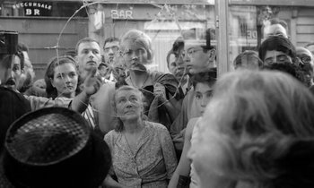 Movie still from “Cléo from 5 to 7” (1962), directed by Agnès Varda – A group of people sitting on a train; Medium shot, High angle