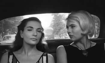 Movie still from “Cléo from 5 to 7” (1962), directed by Agnès Varda – Two women sitting in the back seat of a car; Close Up shot, Low angle