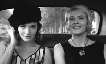 Movie still from “Cléo from 5 to 7” (1962), directed by Agnès Varda – Two women sitting in the back seat of a car; Close Up shot, Low angle
