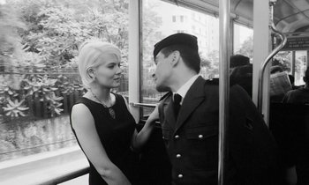 Movie still from “Cléo from 5 to 7” (1962), directed by Agnès Varda – A man and a woman on a bus; Medium shot, Low angle