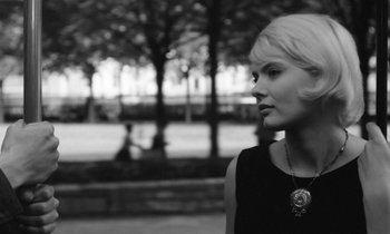 Movie still from “Cléo from 5 to 7” (1962), directed by Agnès Varda – Black and white photograph of a woman in a park; Close Up shot, Low angle