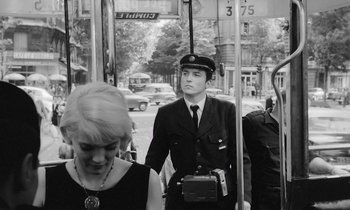 Movie still from “Cléo from 5 to 7” (1962), directed by Agnès Varda – A black and white photo of a man in a uniform; Medium shot, Low angle