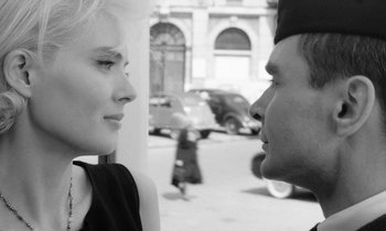 Movie still from “Cléo from 5 to 7” (1962), directed by Agnès Varda – A man and a woman face to face on the street; Close Up shot, Over the shoulder angle