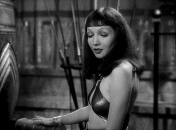 Movie still from “Cleopatra” (1934), directed by Cecil B. DeMille – A black and white photo of a woman in a bikini; Medium shot, High angle