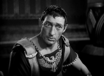 Movie still from “Cleopatra” (1934), directed by Cecil B. DeMille – A man in roman garb is looking at the camera; Close Up shot, High angle
