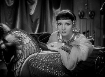 Movie still from “Cleopatra” (1934), directed by Cecil B. DeMille – An old photo of a woman posing for a picture; Medium shot, High angle