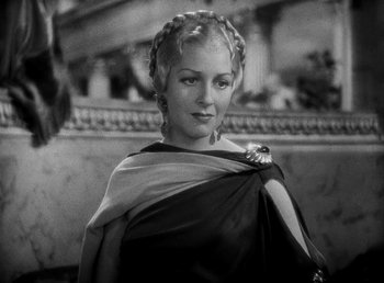 Movie still from “Cleopatra” (1934), directed by Cecil B. DeMille – A black and white photo of a woman in a roman outfit; Close Up shot, High angle