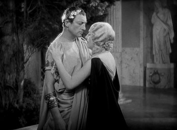 Movie still from “Cleopatra” (1934), directed by Cecil B. DeMille – A man and a woman dressed in ancient roman garb; Medium shot, High angle