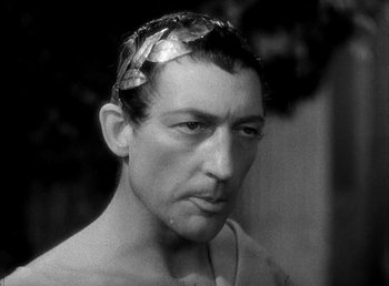 Movie still from “Cleopatra” (1934), directed by Cecil B. DeMille – A black and white photo of a man with a head band; Close Up shot, High angle
