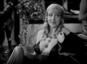 Movie still from “Cleopatra” (1934), directed by Cecil B. DeMille – An old photo of a woman in a black dress; Close Up shot, High angle