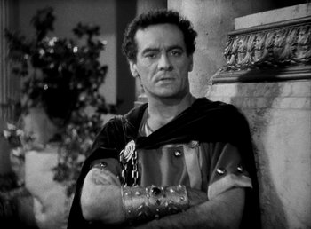 Movie still from “Cleopatra” (1934), directed by Cecil B. DeMille – Black and white photograph of a man in roman garb; Medium shot, High angle