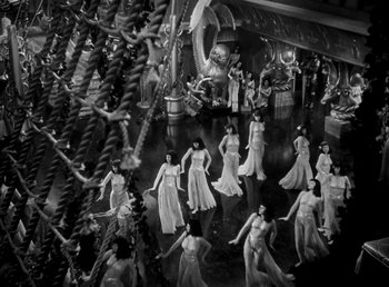 Movie still from “Cleopatra” (1934), directed by Cecil B. DeMille – A black and white photo of a group of women dancing; Extreme Wide shot, High angle