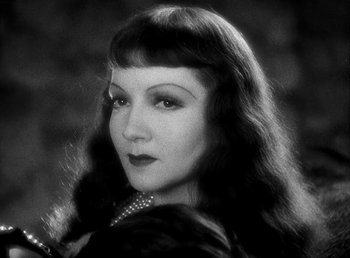 Movie still from “Cleopatra” (1934), directed by Cecil B. DeMille – A black - and - white photo of a woman with long hair; Close Up shot, Low angle