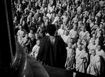 Movie still from “Cleopatra” (1934), directed by Cecil B. DeMille – A large group of people standing together in a crowd; Extreme Wide shot, High angle