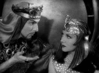Movie still from “Cleopatra” (1934), directed by Cecil B. DeMille – A man and a woman dressed in medieval garb; Medium shot, High angle