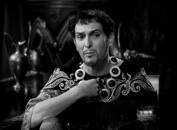Movie still from “Cleopatra” (1934), directed by Cecil B. DeMille – A black and white photo of a man in a costume; Close Up shot, High angle